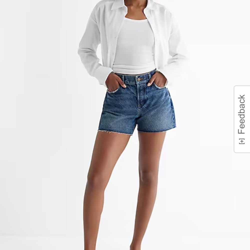 Mid Rise Medium Wash Raw Hem Midi Jean Shorts